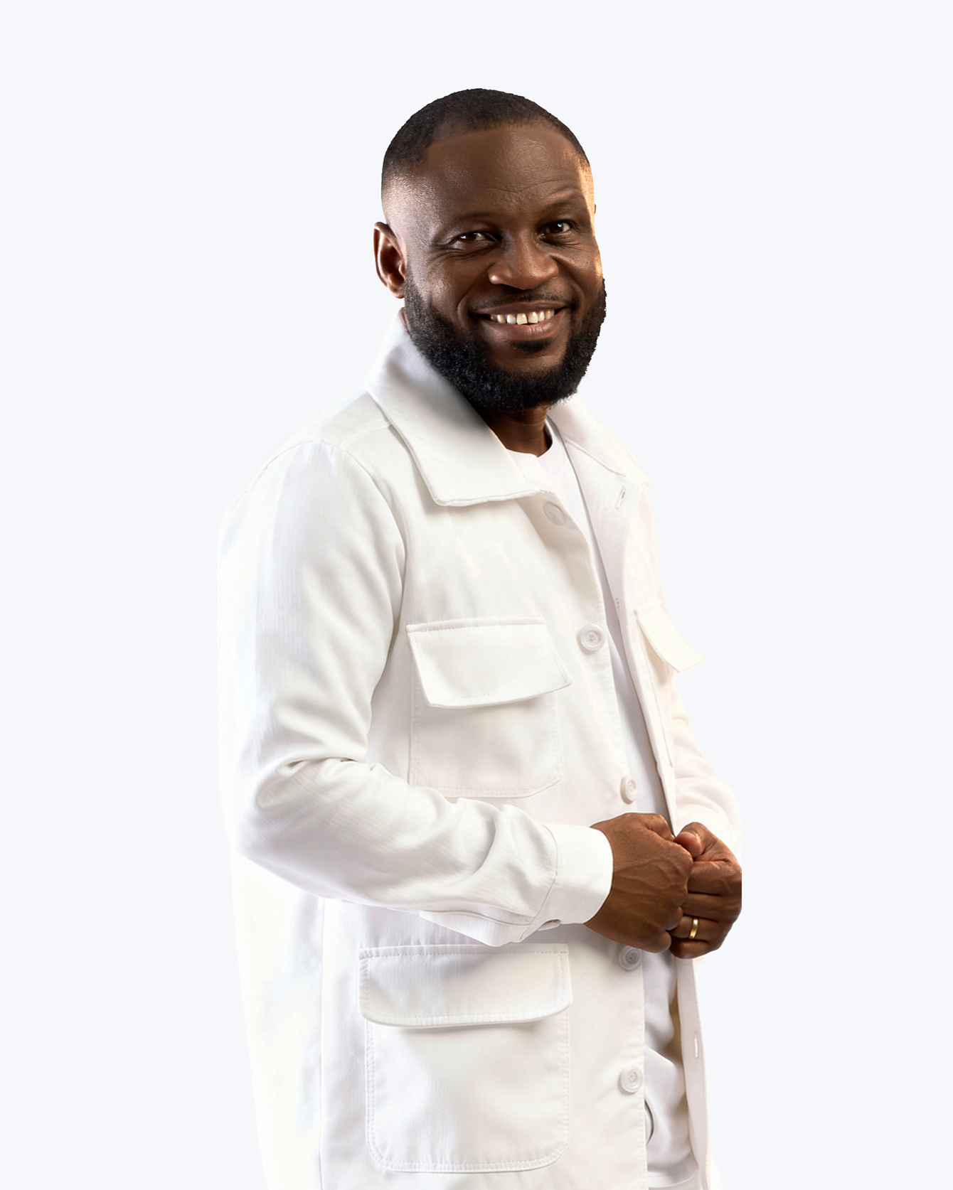 Pastor Edwin Dadson smiling in a white jacket