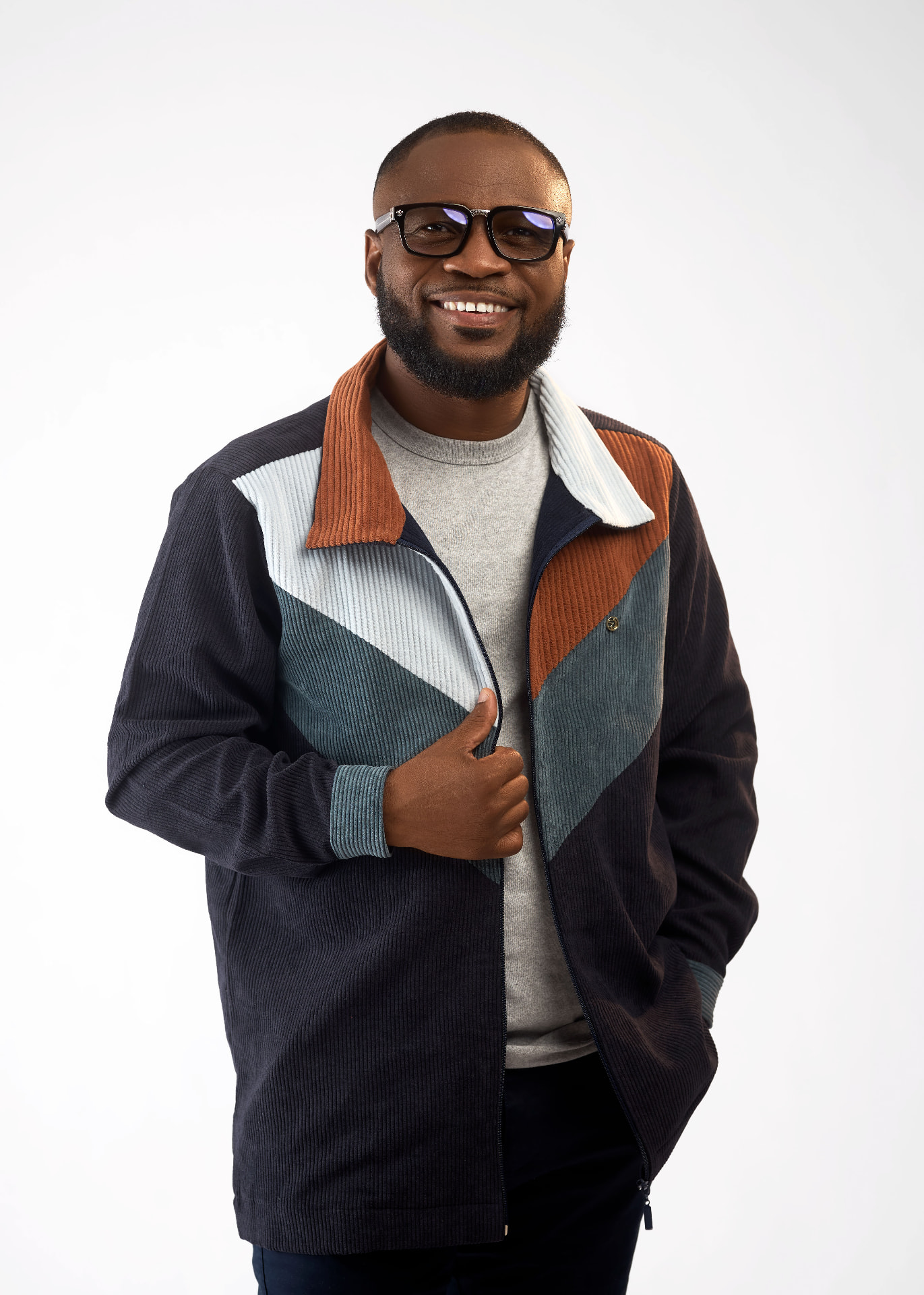 Studio portrait of Pastor Edwin Dadson wearing glasses